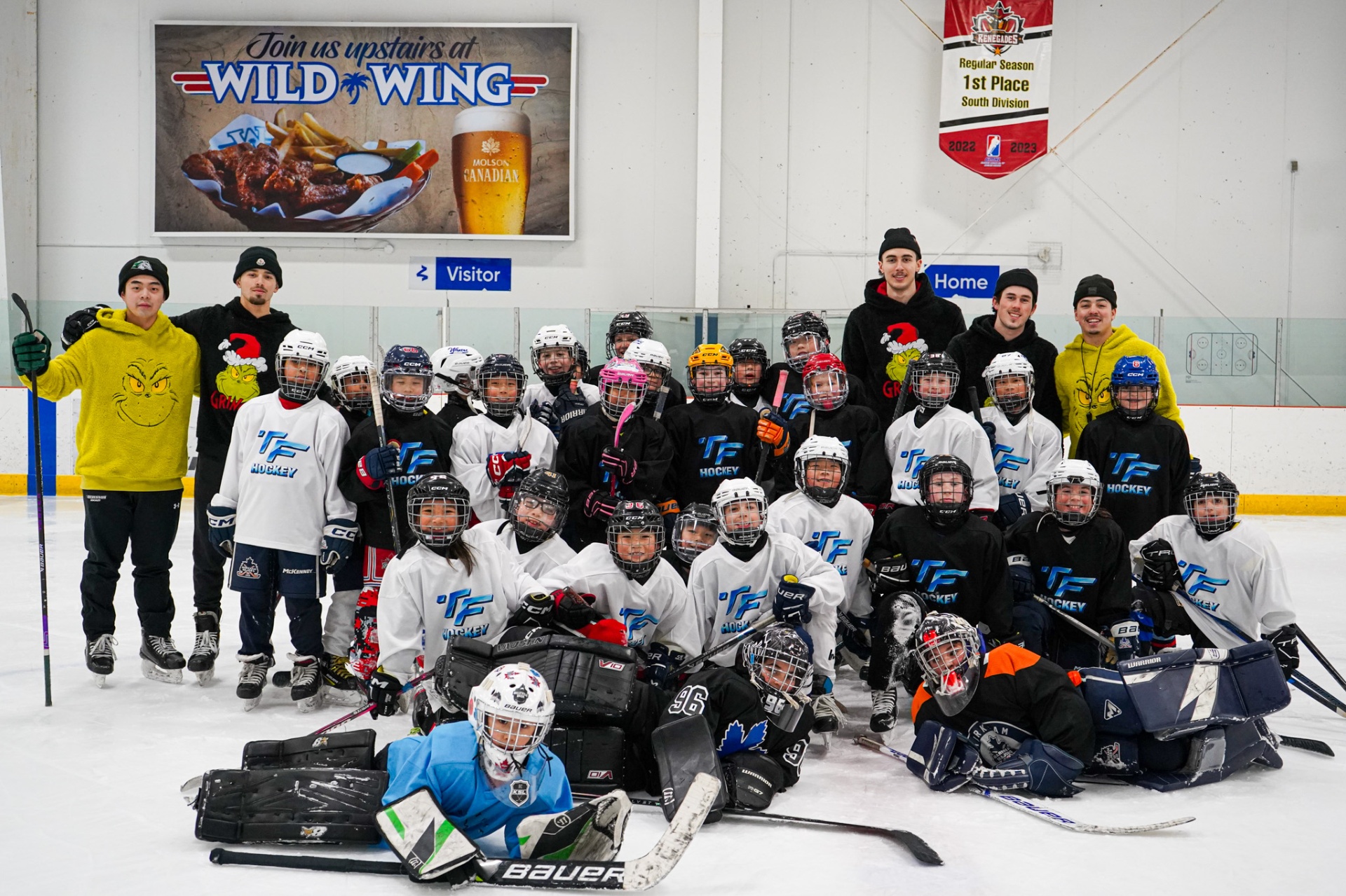 TF Hockey team group photo on the ice
