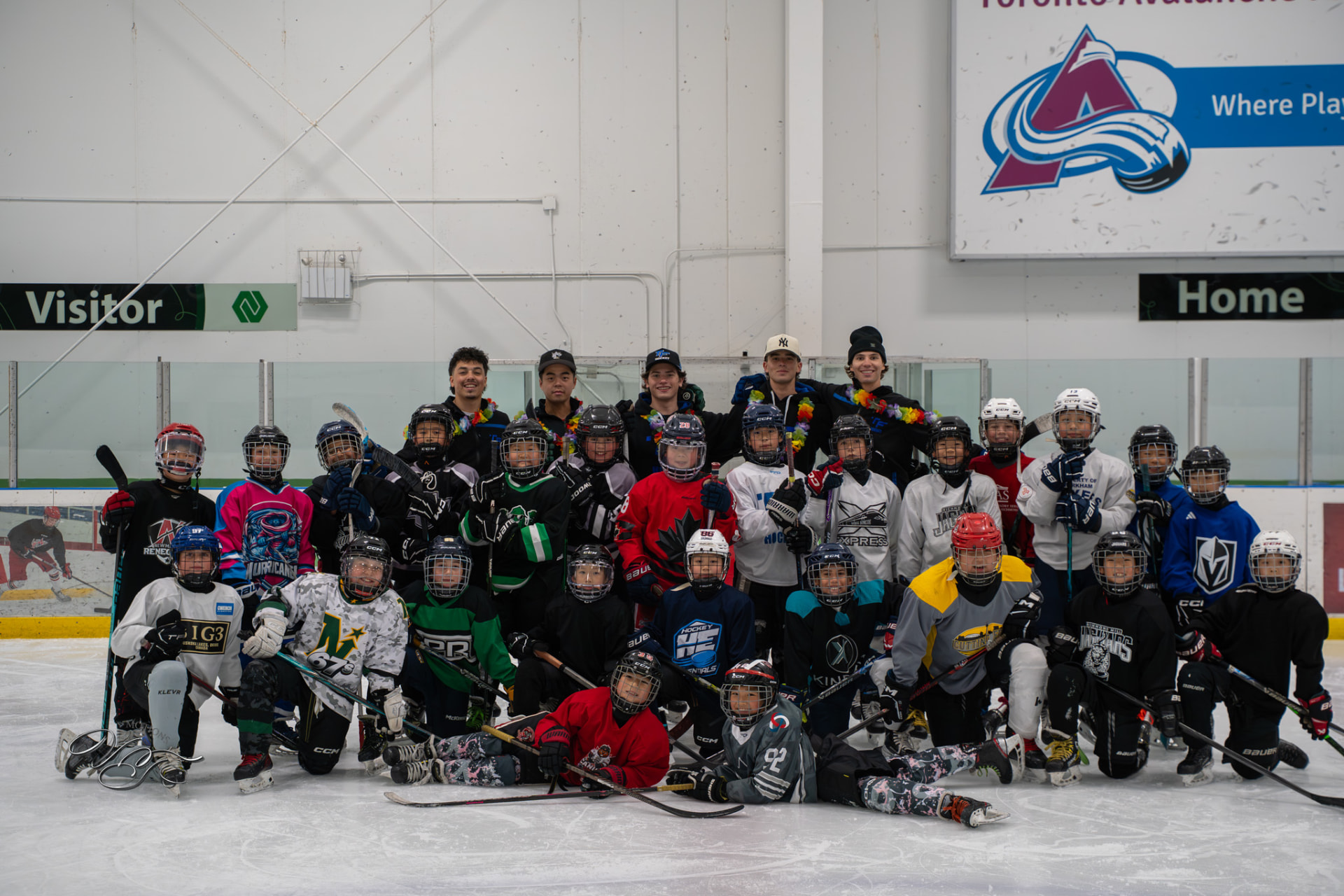 TF Hockey Summer Camp group photo on the ice with coaches and players