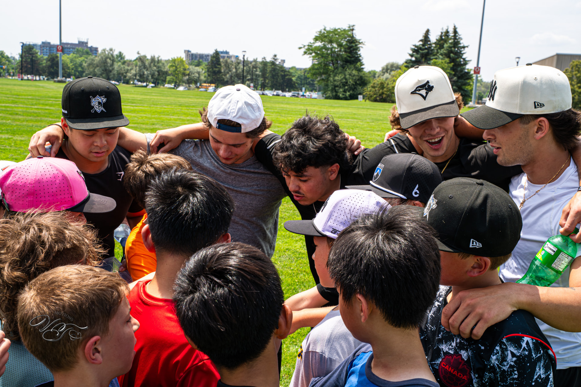 TF Hockey Summer Camp outdoor team huddle with coaches and players